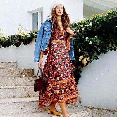 A lady wearing Bohemian Vintage Casual Beach Dress front view paired with accessories, chunk heels and denim jacket.